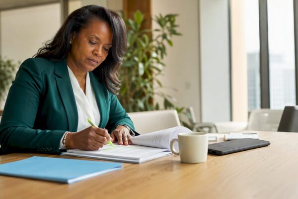 Female attorney reviewing PR strategy document in office