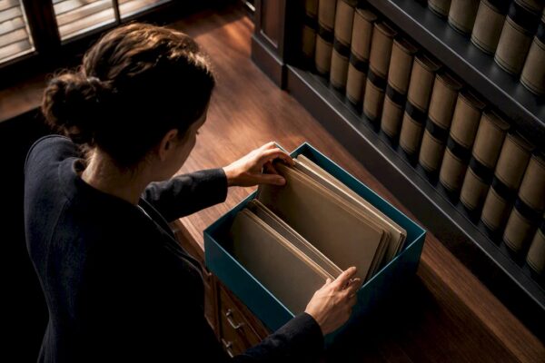 Researcher organizing legal record folders