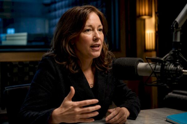 Author rehearsing beside a radio microphone